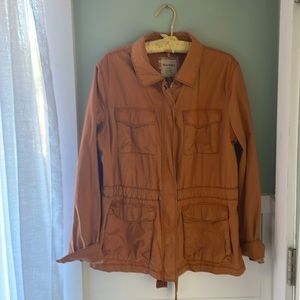 Rust orange women’s trench / safari jacket.
